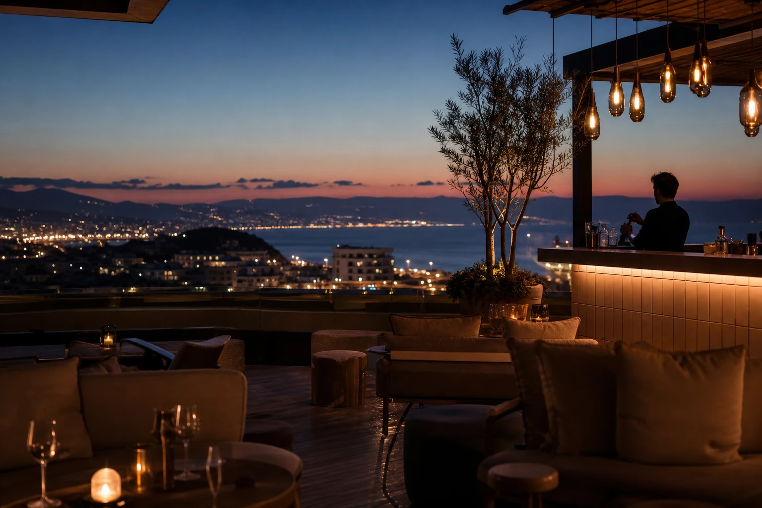 Rooftop cocktail bar at blue hour with lounge seating